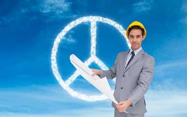 Poster - Composite image of serious architect with hard hat holding plans