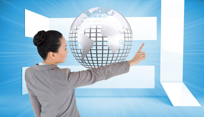 Aufkleber - Composite image of unsmiling asian businesswoman pointing