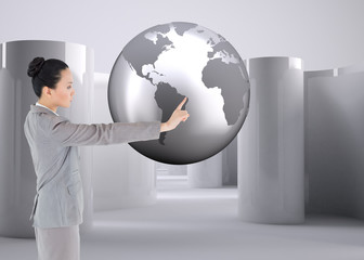 Aufkleber - Composite image of unsmiling asian businesswoman pointing