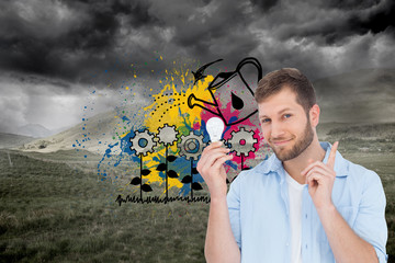 Poster - Composite image of charming model holding a bulb in right hand