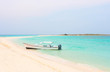 Boat at the tropical beach of Cayo de Agua island, Los Roques