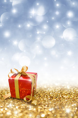 Wall Mural - red gift on golden glitter