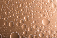 Clear Brown Water Drops Over Brown Background