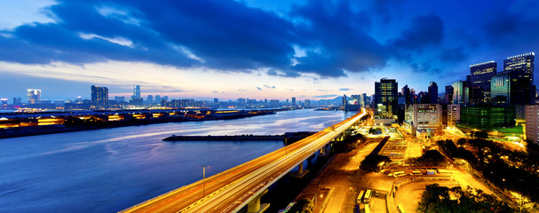 Wall Mural - Panoramic view of the highway overpass at dusk in modern city