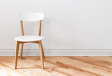 Fototapeta  - White chair in an empty room