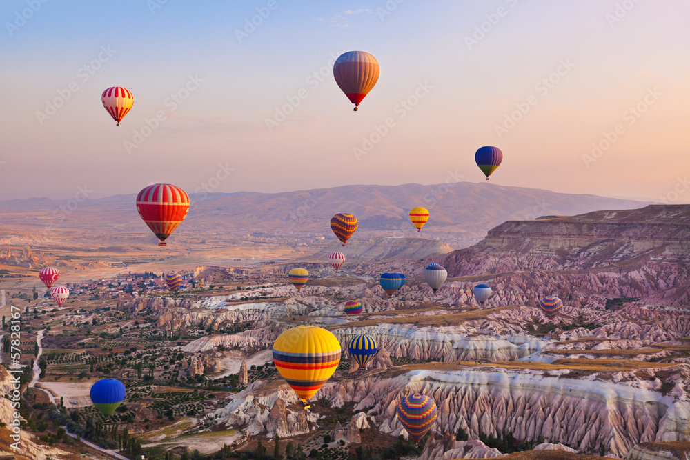 Hot air balloon flying over Cappadocia Turkey - obrazy, fototapety, plakaty 