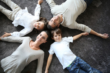 Wall Mural - Upper view of happy family of four