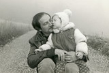 Fototapeta Młodzieżowe - Young father with his son - circa 1973