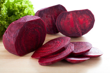 Wall Mural - Purple beetroot on wooden board