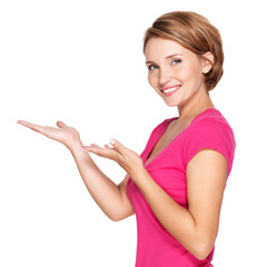 Wall Mural - Portrait of adult happy woman with presentation gesture