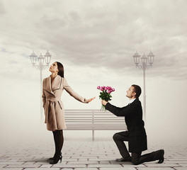 Poster - woman rejecting man with flowers