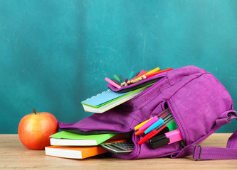 Purple backpack with school supplies