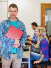 Poster - Teacher with young college students using computers in computer