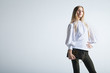 © julenochek - Fashionable woman with a bag in light background