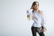 © julenochek - Fashionable woman with a bag in light background