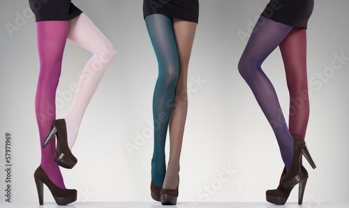 Naklejka dekoracyjna collection of colorful stockings on sexy woman legs on grey