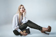 © julenochek - Fashionable woman with a bag in light background