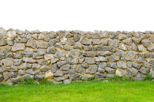 Fence Real Stone Wall Surface With Cement On Green Grass Field