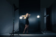 © julenochek - Beautiful woman posing at studio in light flashes