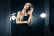 © julenochek - Beautiful woman posing at studio in light flashes