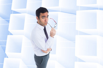 Poster - Composite image of unsmiling businessman holding glasses