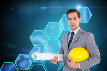 Poster - Composite image of serious architect holding plans and hard hat