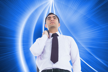 Poster - Composite image of businessman standing holding his jacket