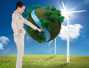 Poster - Composite image of smiling asian businesswoman pointing