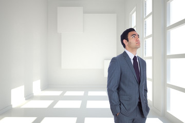 Poster - Composite image of unsmiling businessman standing