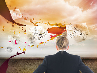 Poster - Composite image of businesswoman standing with hands on hips
