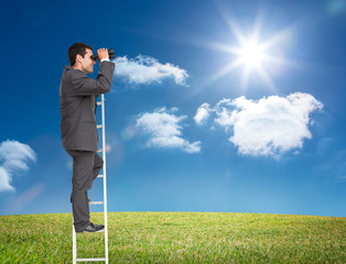 Poster - Composite image of businessman standing on ladder