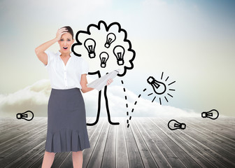 Poster - Composite image of shocked classy businesswoman holding newspape