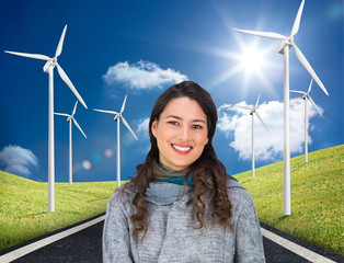 Poster - Composite image of smiling model wearing winter clothes holding