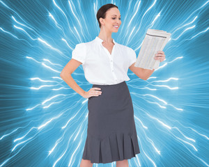 Poster - Composite image of cheerful stylish businesswoman holding newspa