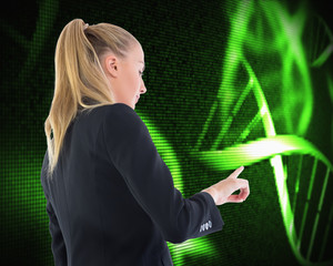 Poster - Composite image of businesswoman pointing somewhere