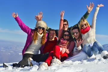 friends have fun at winter on fresh snow