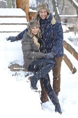 Wall Mural - Outdoor photo of happy couple at winter