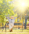 © Ljupco Smokovski - Relaxed senior gentleman sitting on bench in park on a sunny day