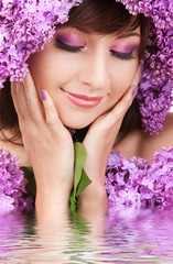 Wall Mural - Young woman with lilac flowers