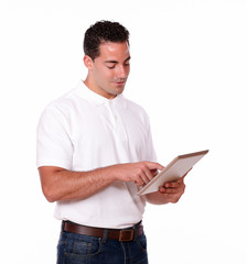 Handsome male looking at his tablet pc