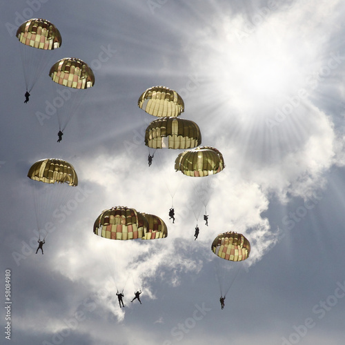 Obraz na plátně The skydivers on stormy sky.