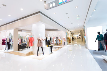 Poster - Boutique display window with mannequins in fashionable dresses