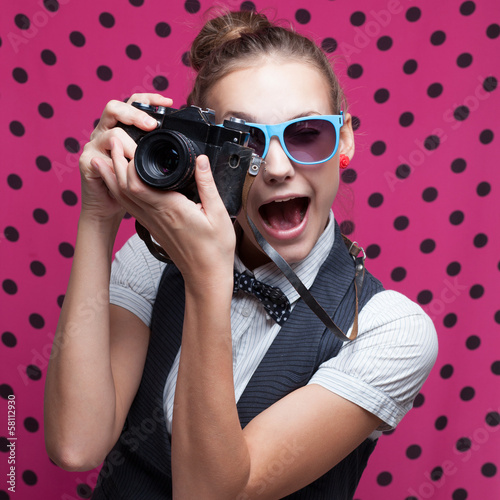 Naklejka ścienna Expressive portrait of female photographer