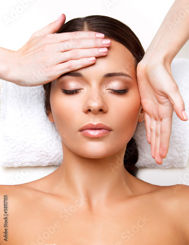 Fotografie, Obraz Face Massage. Close-up of a Young Woman Getting Spa Treatment.