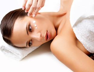 Wall Mural - Close-up of a Young Woman Getting Spa Treatment. Cosmetic Cream