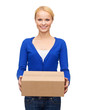 © Syda Productions - smiling woman in casual clothes with parcel box