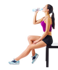 Wall Mural - Young sporty girl on with water bottle