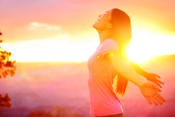 free happy woman enjoying nature sunset