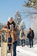 © CandyBox Images - Sunny winter day people in snow countryside
