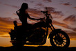 © Poulsons Photography - Silhouette of woman sitting on motorcycle